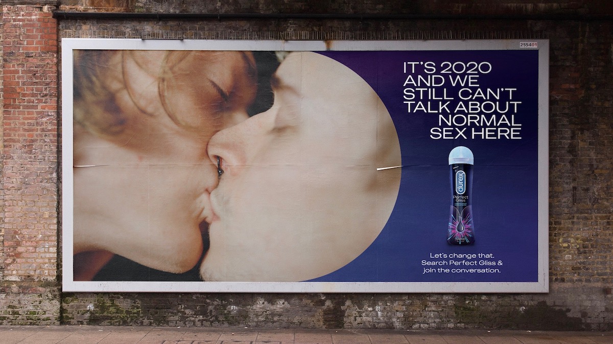 Durex advert showing two men kissing on an advert for Durex Perfect Gliss lubricant